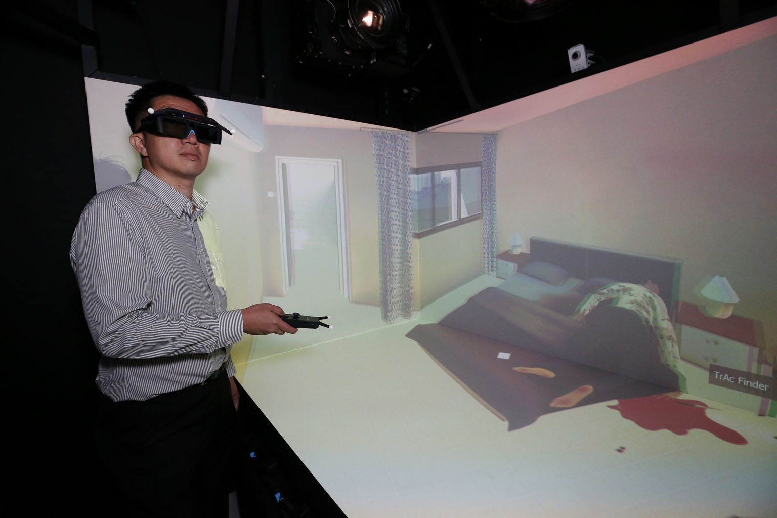 A Home Team officer investigating a simulated crime scene at the Human Performance Centre. Launched yesterday, the place is a scientific research facility that deploys cutting-edge technology to advance the Home Team's operative capabilities. 