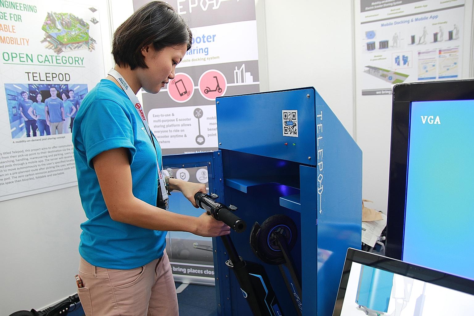 Telepod CEO Gan Jin Ni with one of her firm's e-scooters and docking stations. The company is aiming to improve the first and last mile of commuter journeys, and was formed in response to an LTA competition that called for innovative transport soluti