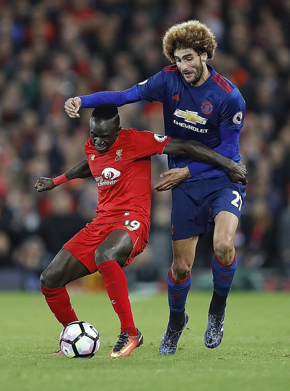 Manchester United's Marouane Fellaini trying to shake his much shorter Liverpool opponent Sadio Mane off the ball in the 0-0 draw on Monday. After their first clean sheet in the league this season, Jurgen Klopp would want his side to keep it tight at