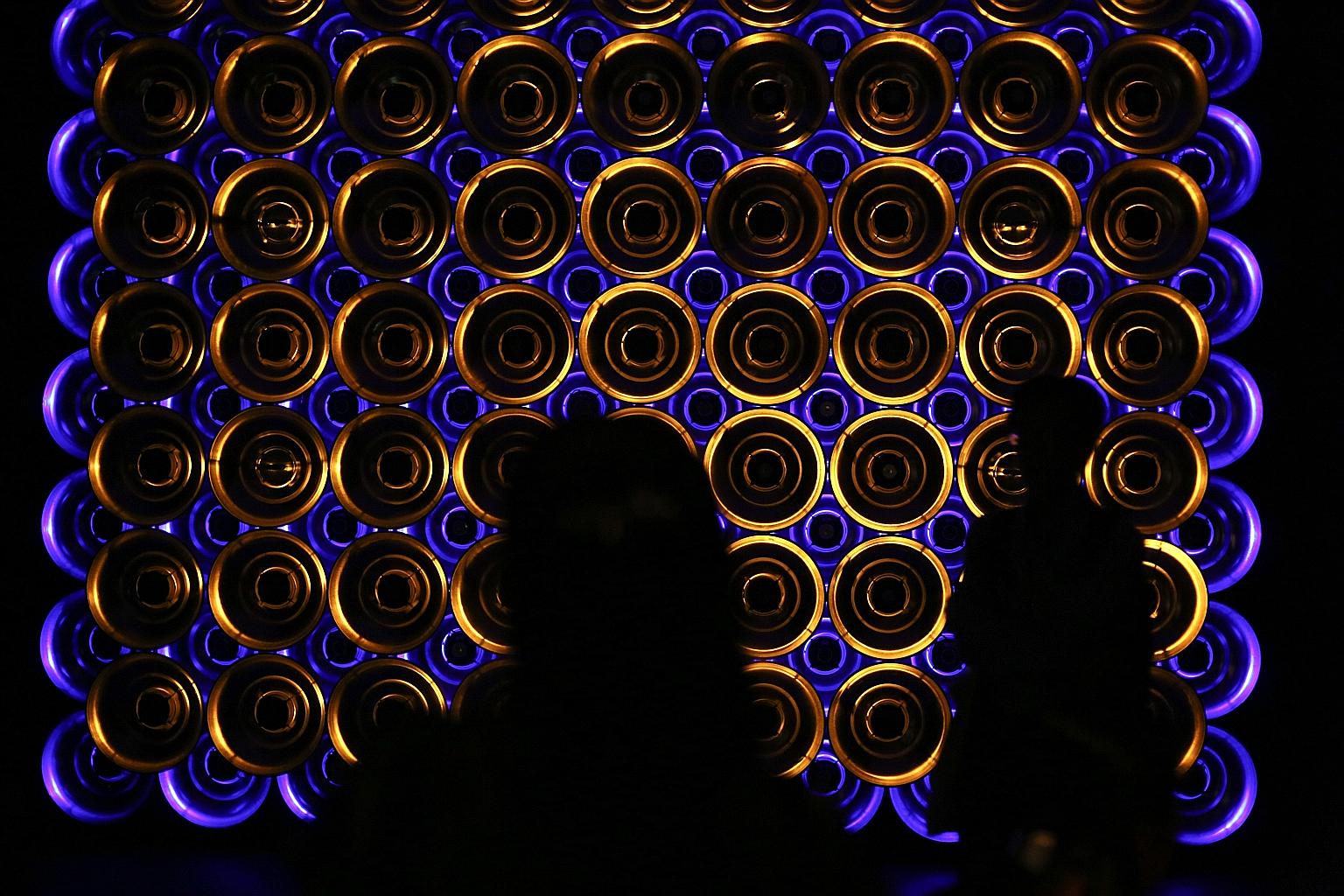 Guests viewing SONICreflection, an exhibit by Singapore sound artist Zulkifle Mahmod, at the official opening of the Singapore Biennale last night by Deputy Prime Minister Tharman Shanmugaratnam at the Singapore Art Museum. The fifth edition of the e