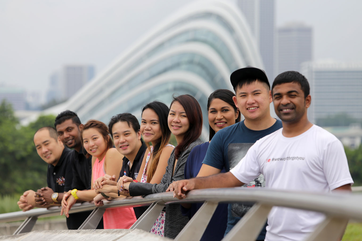 Nine of the 15 organisers of 50cube. Mr Koh (second from right) and Ms Oh (fourth from right) are pictured with (from left) Mr Jeremy Tan, Mr K. Premanathan Pillai, Ms Lynne Soon, Mr Roger Pho, Ms Idriaty Sabari, Ms Katrina Adela and Mr George Cherukara J