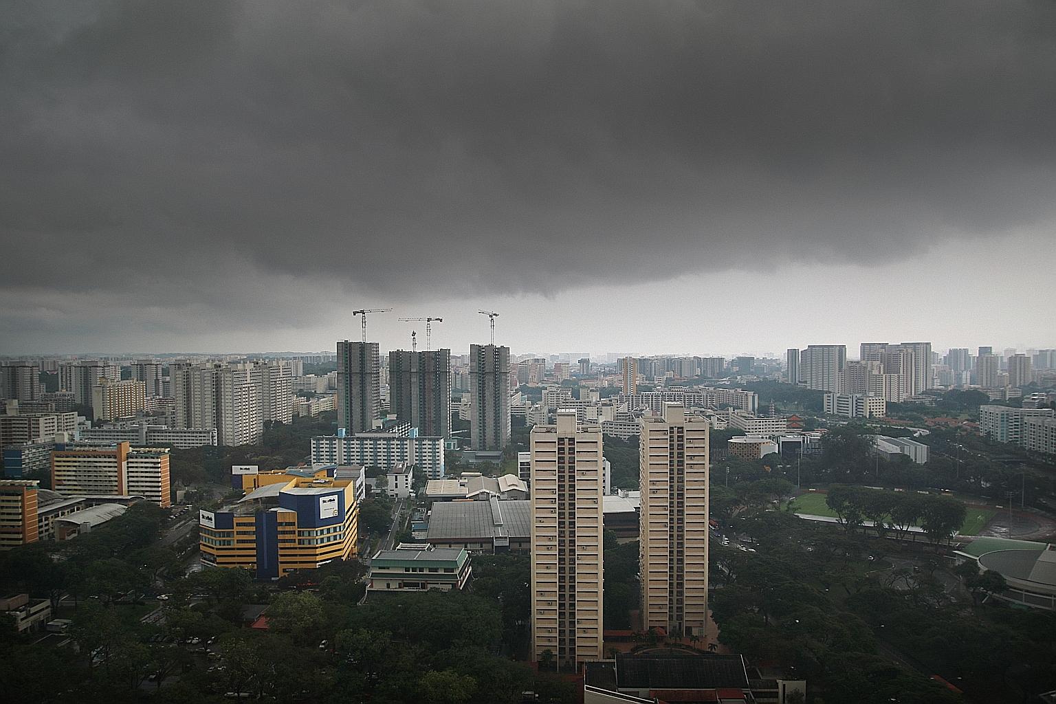 Dark skies over Toa Payoh yesterday afternoon. The wet weather will persist until the end of the month, with more thundery showers in the hours before dawn and in the morning. Most of the rainfall in the first two weeks of this month was due to Sumat