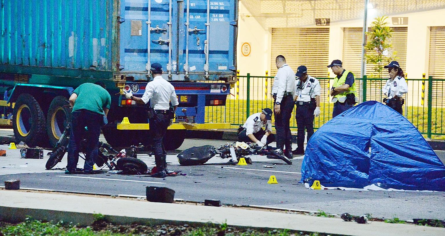 The accident site at the junction of Pandan Crescent yesterday. The 34-year-old driver of the trailer was arrested on suspicion of causing death by negligence. E-bike users Ang Yee Fong and Ong Zi Quan died, while a third, Marcus Loke, sustained inju