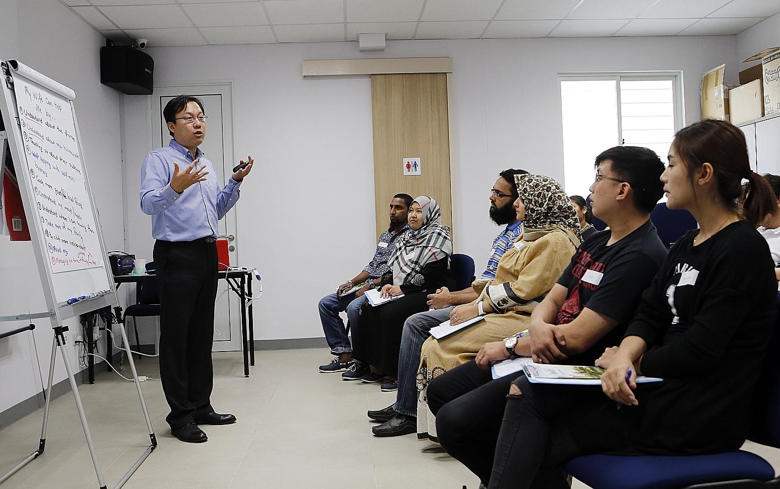 Mr Paul, a social worker with Fei Yue Community Services, conducts the one-day Marriage Support Programme for transnational couples.