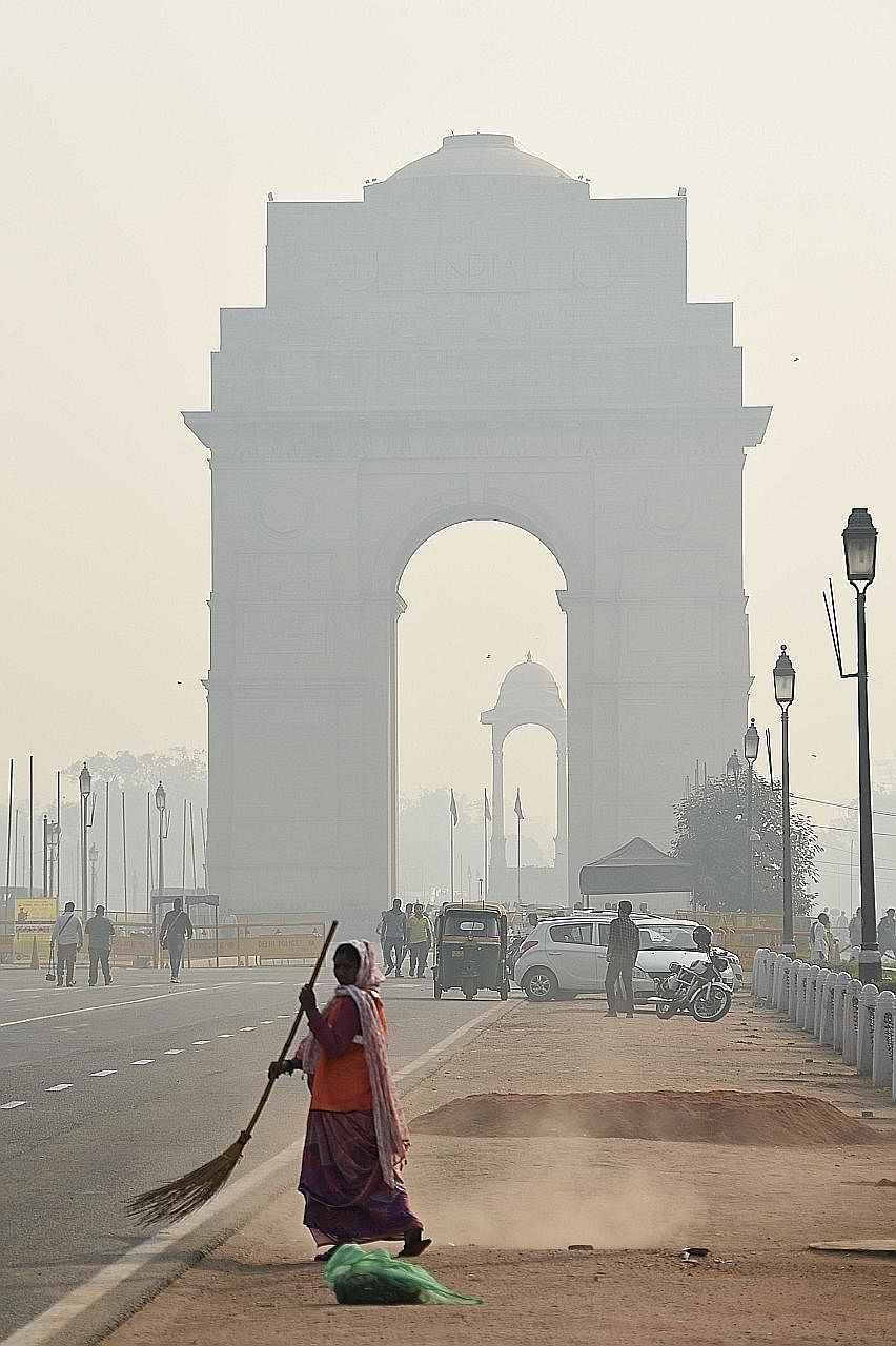 The India Gate monument on Friday. Residents in Delhi had to bear with days of smoke as the city celebrated Diwali - also known as Deepavali - with fireworks.