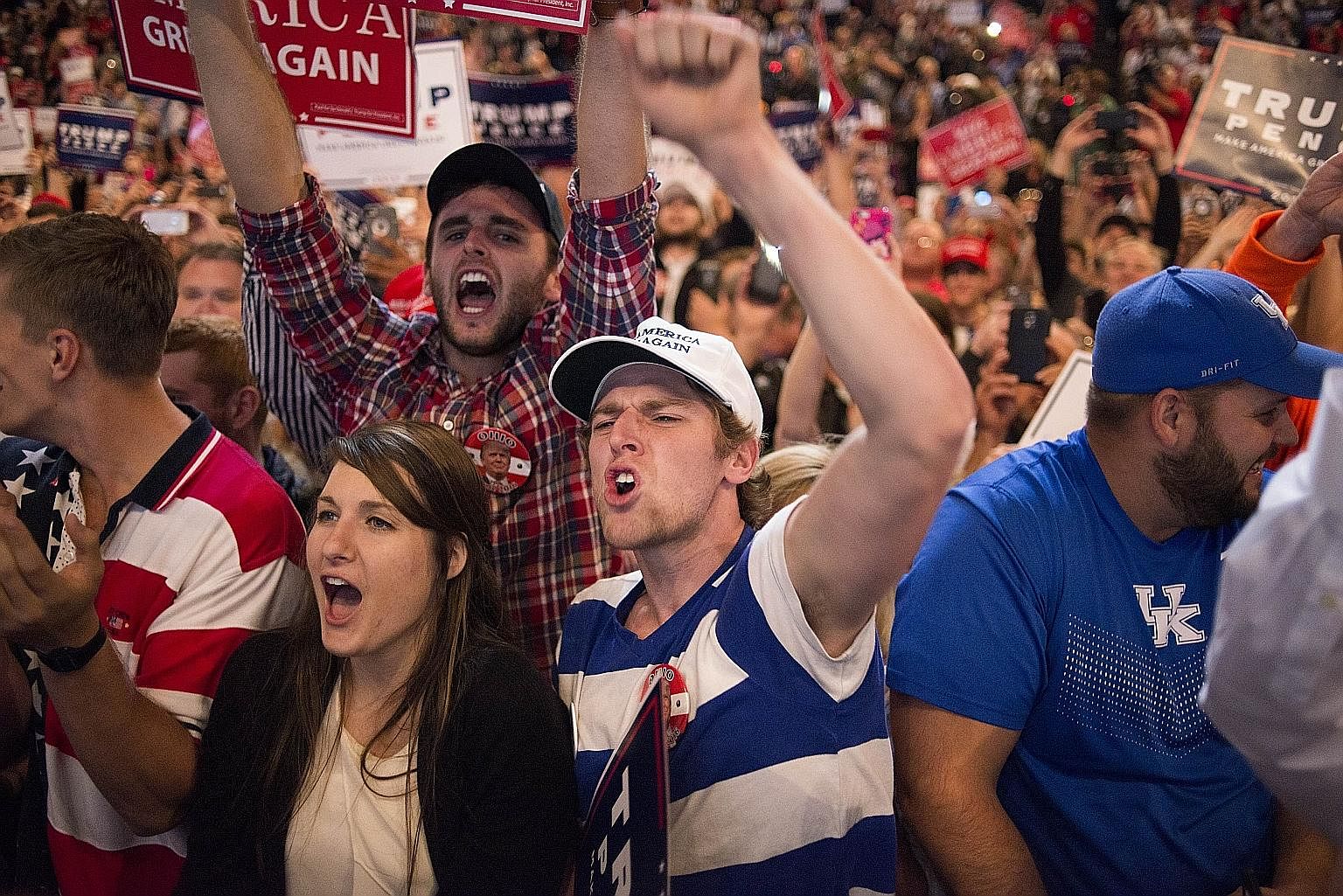 Supporters at a rally for Mr Trump on Oct 13 in Cincinnati, Ohio. The rhetoric in the campaigning has been unusually corrosive, unearthing old social, racial and geographic fault lines, and leaving many Americans and outsiders wondering at the future