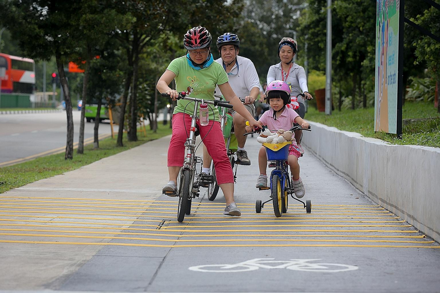 Young and old enjoying the new cycling paths yesterday. As Singapore's first eco-town, Punggol is also developing its waterfront spaces and amenities.