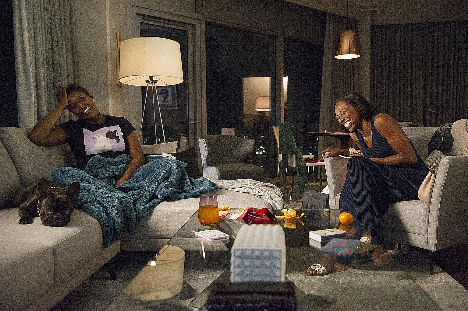 Yvonne Orji (far left) and Issa Rae in Insecure.