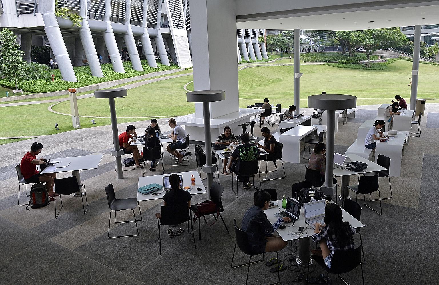 Students studying at the National University of Singapore University Town. With NUS expanding its residential college model, where students live and learn with professors, half of the freshmen can spend at least one year living and learning on campus
