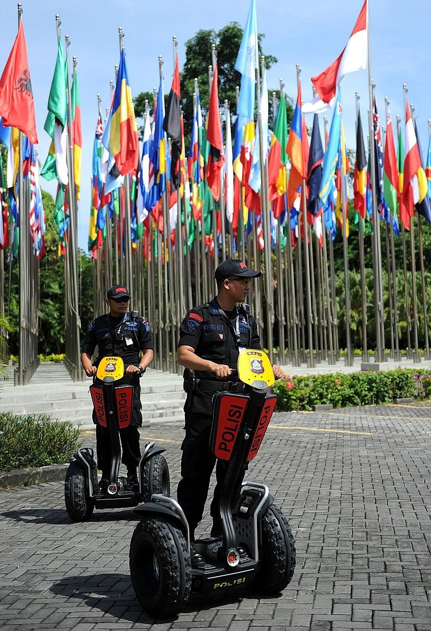 Indonesia police on patrol in Nusa Dua, on the resort island of Bali, where the 85th International Police (Interpol) General Assembly was held yesterday.