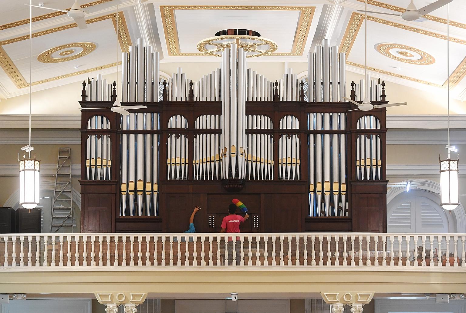 The cathedral's crucifix has been hung in its original position and the marble altar put up. Back in place also are the semi-circular stained glass panels above the doors, the chandeliers and the Stations of the Cross paintings. The cathedral also ha