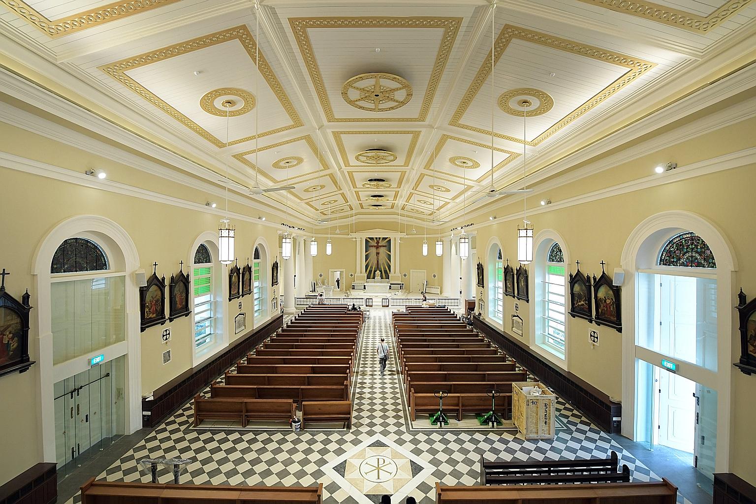 The cathedral's crucifix has been hung in its original position and the marble altar put up. Back in place also are the semi-circular stained glass panels above the doors, the chandeliers and the Stations of the Cross paintings. The cathedral also ha
