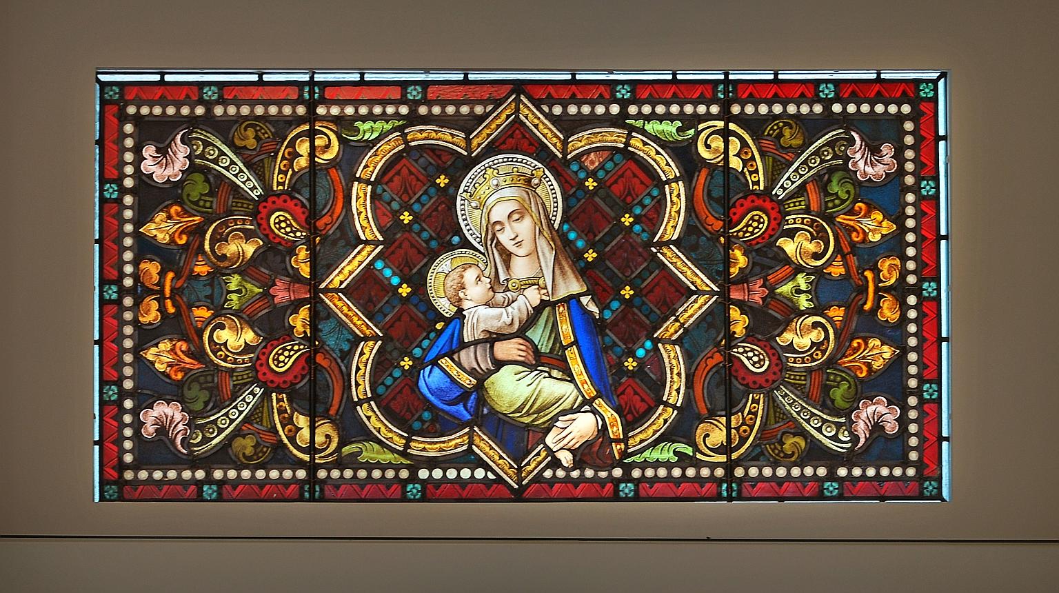 The cathedral's crucifix has been hung in its original position and the marble altar put up. Back in place also are the semi-circular stained glass panels above the doors, the chandeliers and the Stations of the Cross paintings. The cathedral also ha