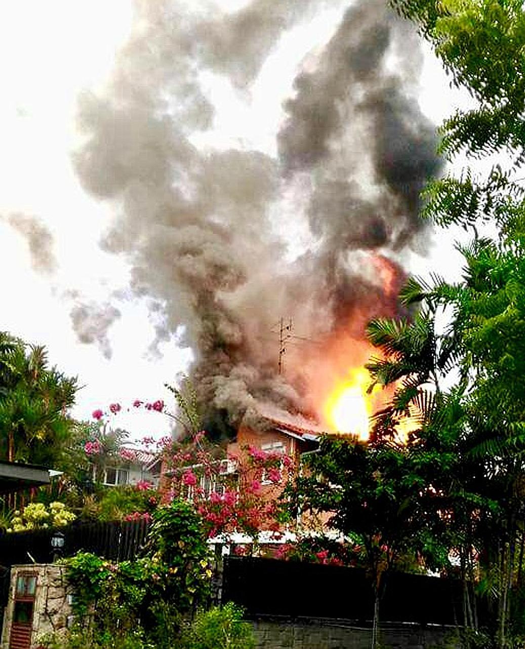 Fire hit the second storey of the bungalow in Sunset Place, with flames shooting through the roof, when firefighters arrived at the scene yesterday.