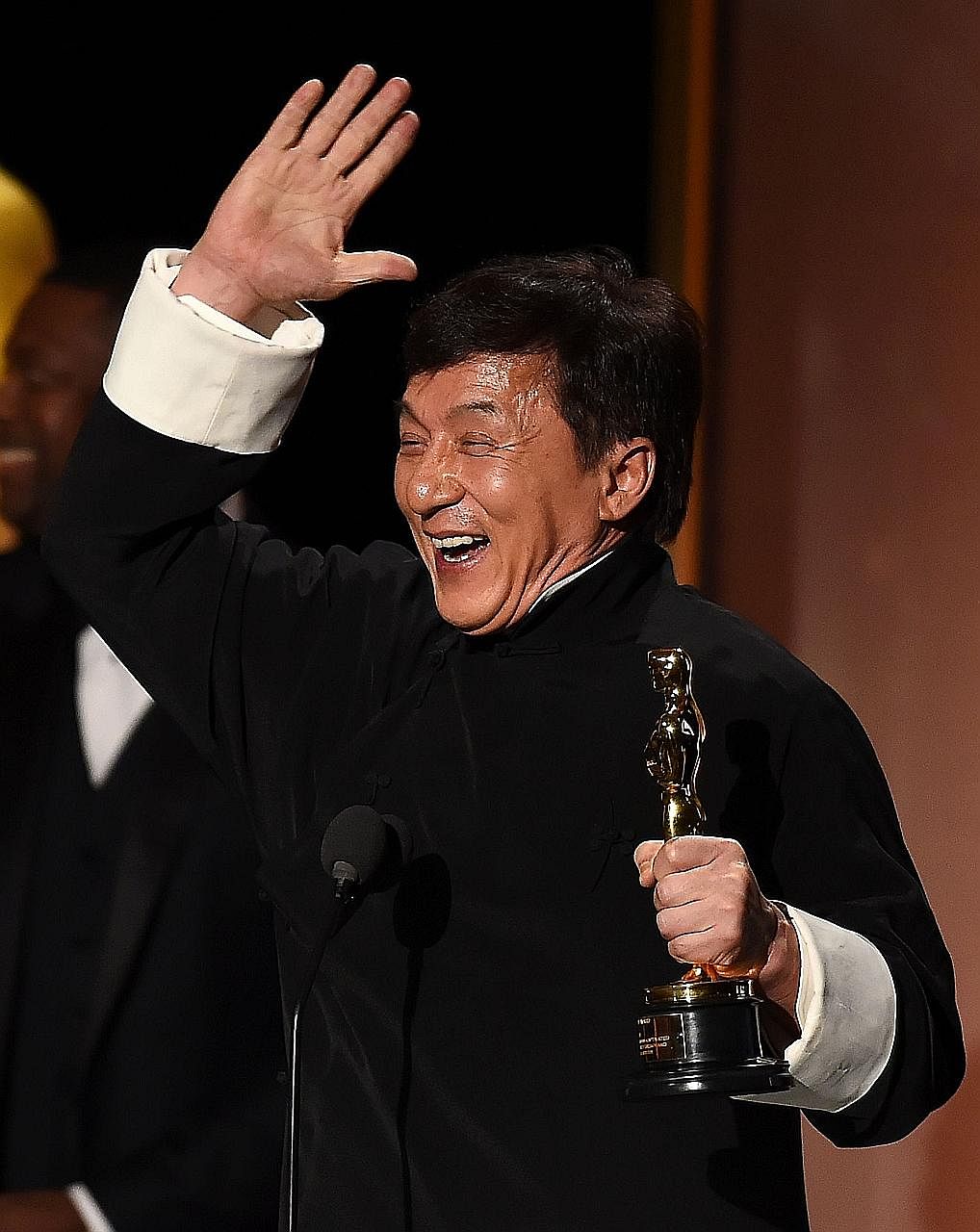 A jubilant Jackie Chan with his Honorary Oscar Award at the Academy's eighth Annual Governors Awards.