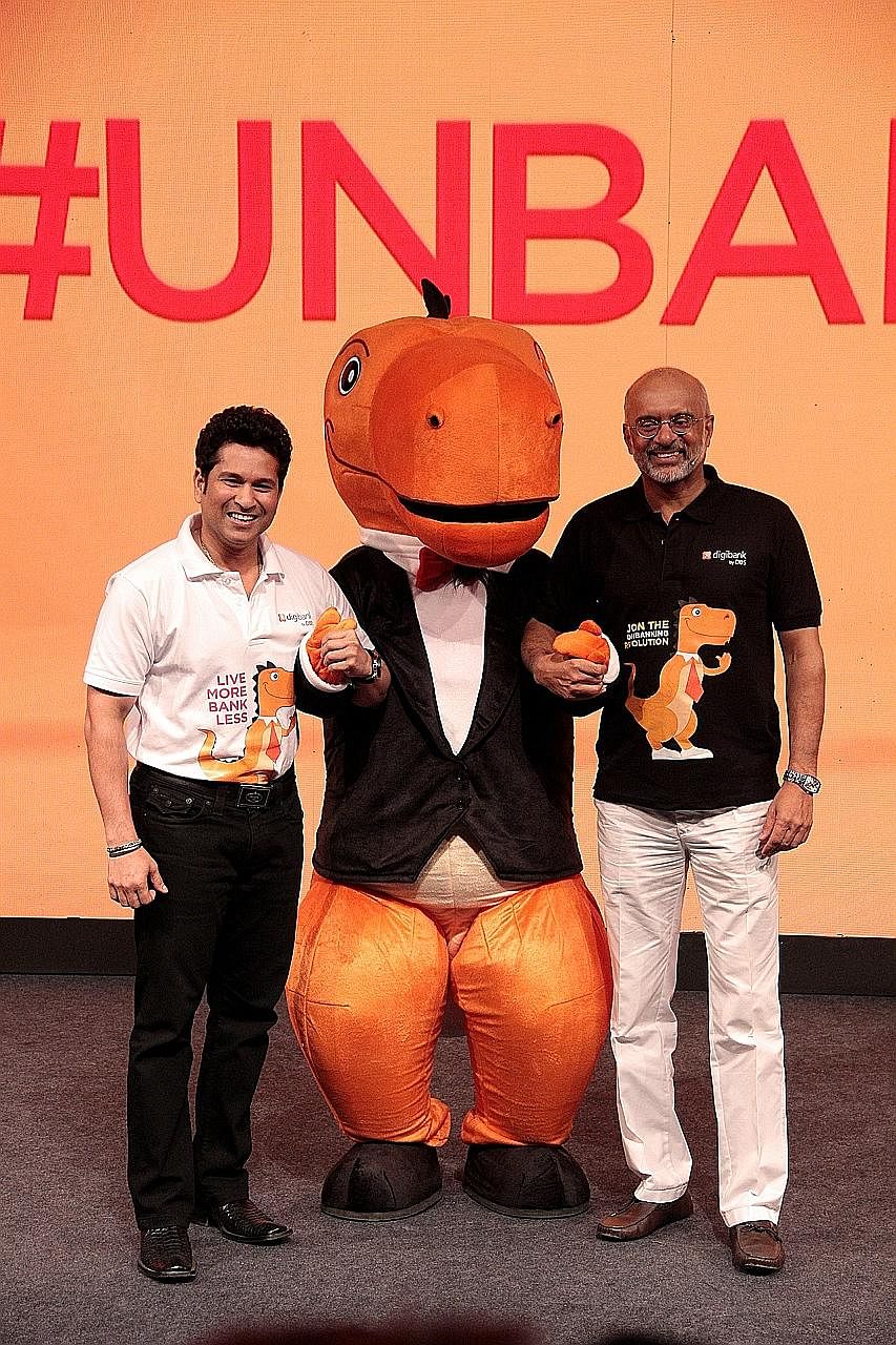Former Indian cricketer Sachin Tendulkar (far left) with DBS chief executive Piyush Gupta at the launch of digibank in India. Above: In May, DBS launched digibank, India's first mobile-only bank.