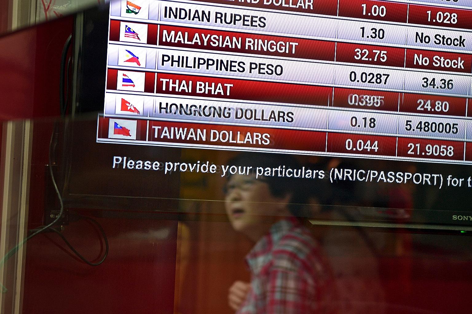 A signboard at one of the Change Alley money changers that had run out of the ringgit yesterday. Money changers were offering between 3.01 and 3.03 to one Singdollar - below the 3.05 up for grabs last week, but demand was still strong.