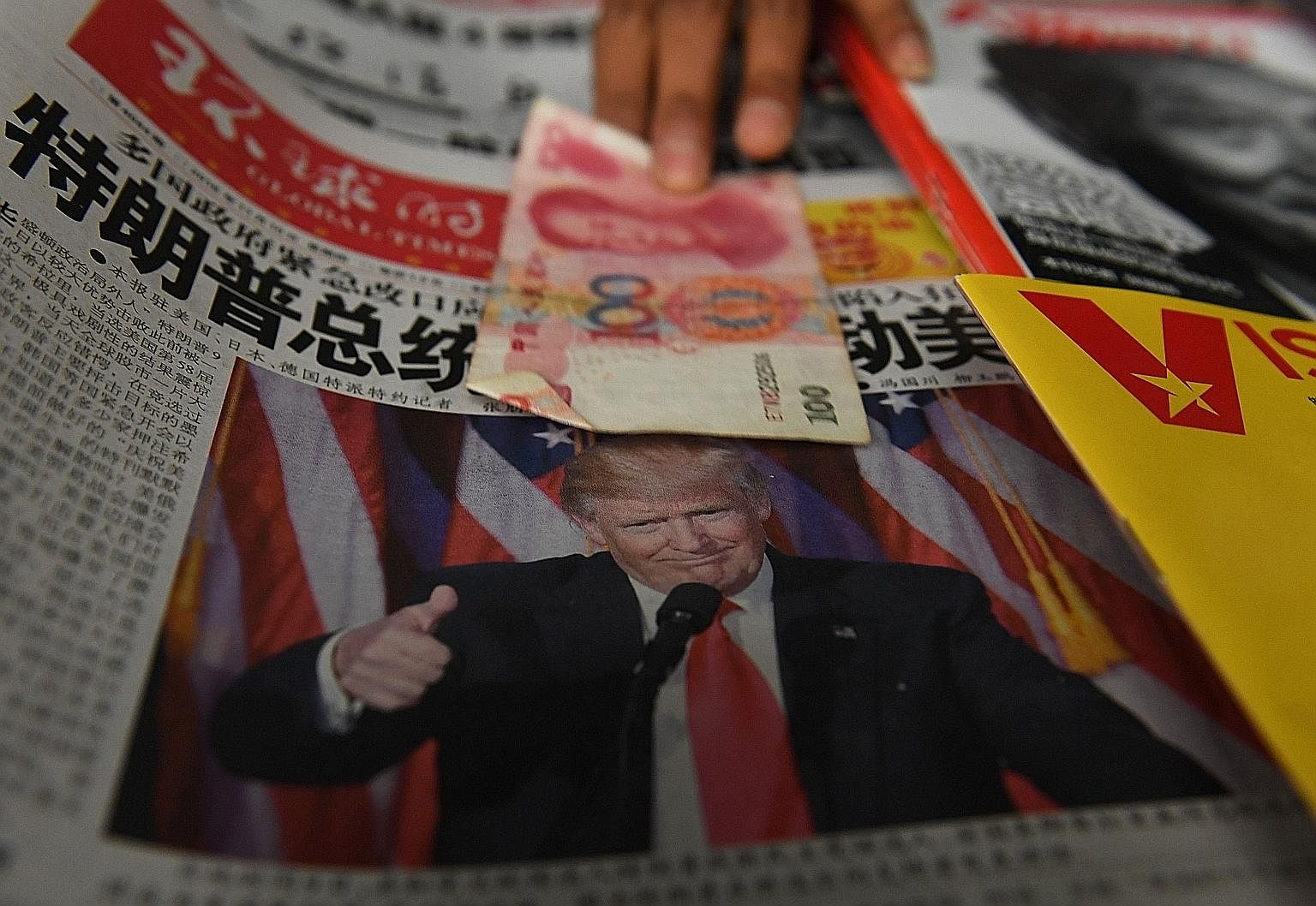 A newspaper with a photo of Mr Trump at a Beijing news-stand last Thursday. The President-elect has made clear his views on China as the source of many US problems. His administration may take a more principled and hard-headed approach to engagement 