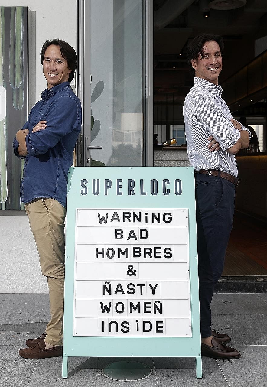 Julian (far left) and Christian Tan at their fun-loving two-month-old Mexican bar and restaurant Super Loco at Customs House.