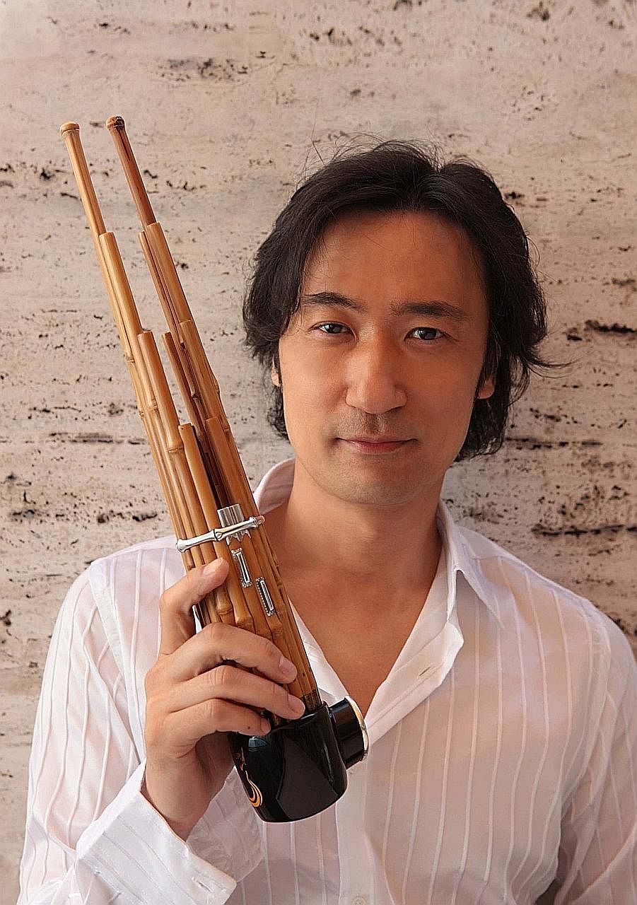 Gagaku player Hideki Togi with a sho, a Japanese reed music instrument.