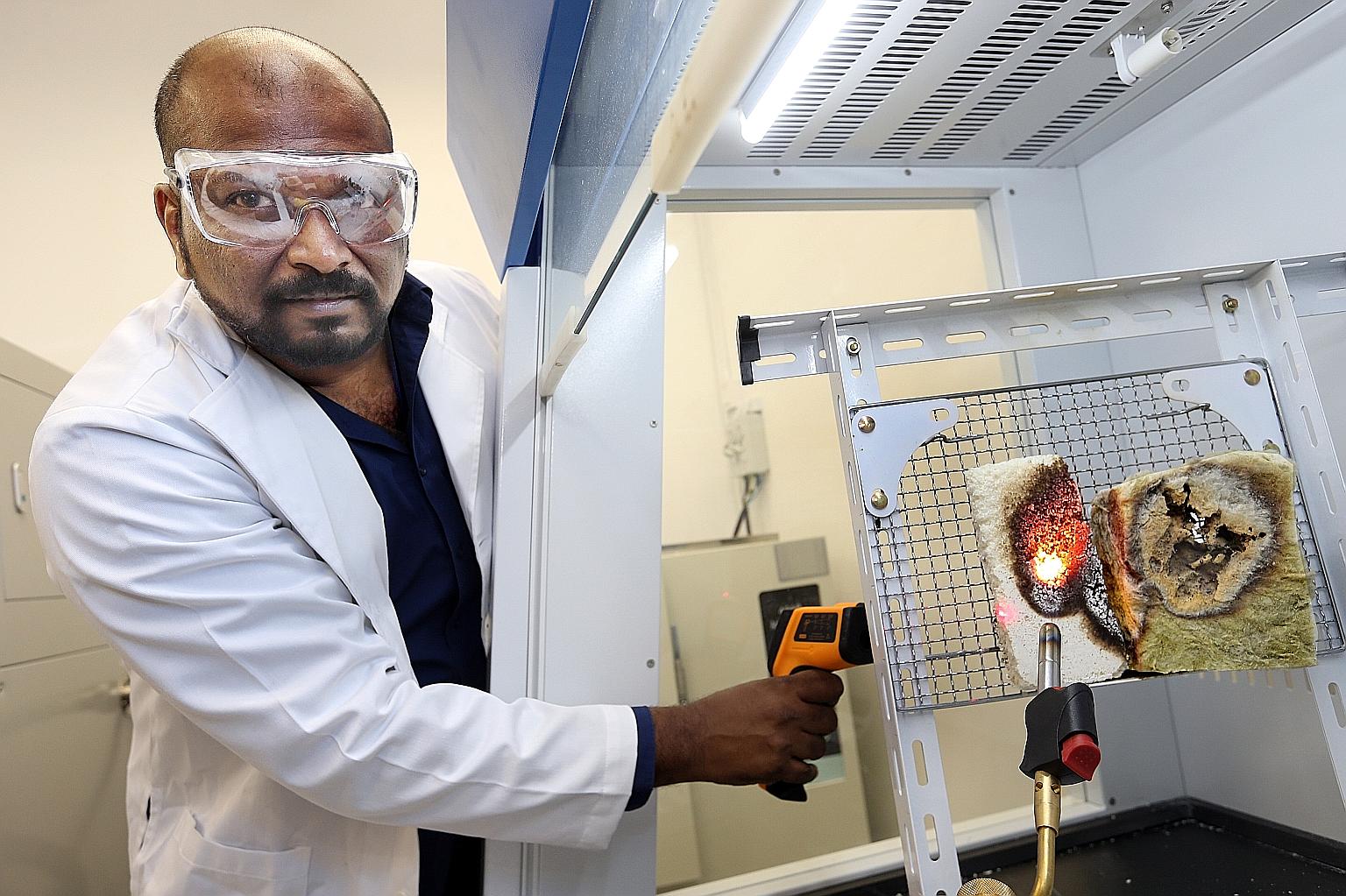 Dr Mahesh demonstrating the fire resistance of NTU's newly developed foam (left) over conventional insulating material (right) when put under a blowtorch flame at almost 2,000 deg C. NTU's innovation and enterprise arm NTUitive has filed a patent for