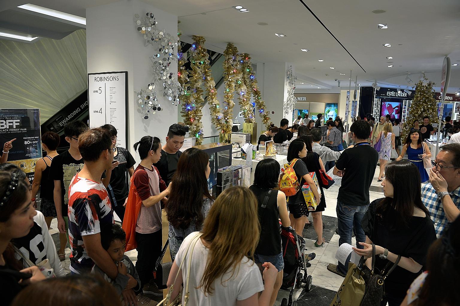Shoppers at Robinsons The Heeren in Orchard Road on Black Friday in November 2014. The department store and furniture retailer Courts will offer promotions for Black Friday, a shopping frenzy which is a US tradition celebrated on the last Friday of N