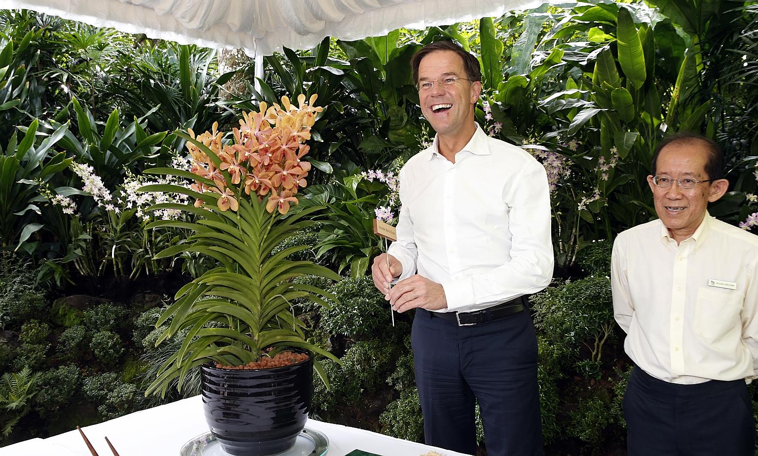 The first stop for Mr Rutte yesterday was the Singapore Botanic Gardens, where an orchid hybrid, Aranda Mark Rutte, was named in his honour. With him is National Parks Board deputy CEO Leong Chee Chiew.