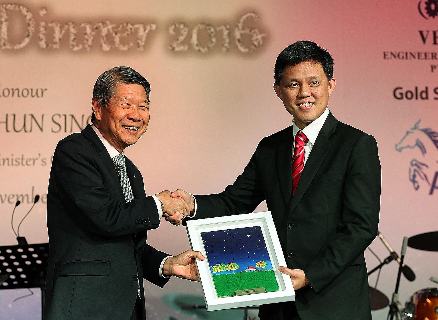 Singapore Children's Society chairman Koh Choon Hui (left) with Minister Chan Chun Sing at the society's event yesterday. Mr Chan called for role models to share their time and talent.