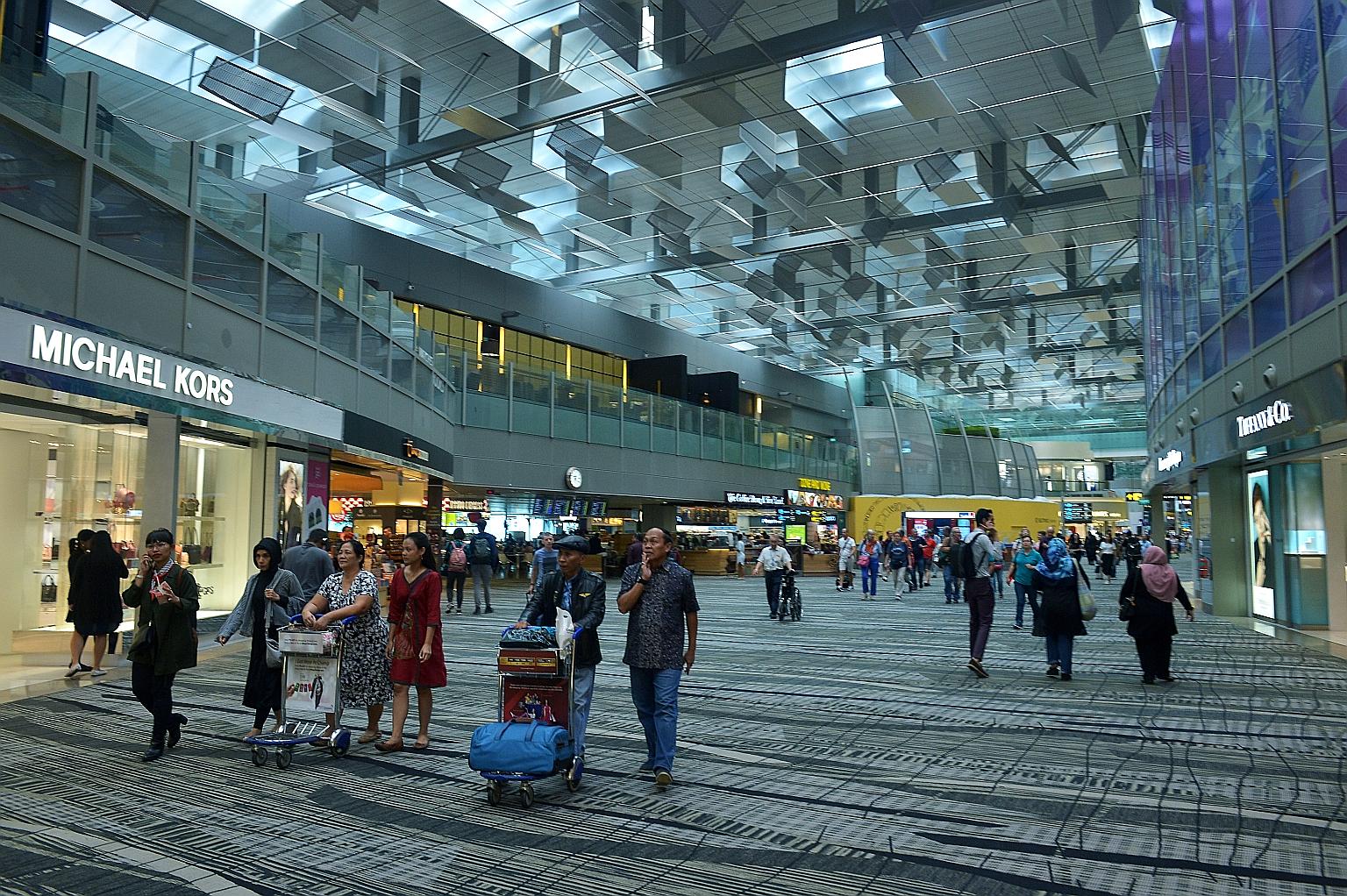 Passengers in transit at Changi Airport Terminal 3. With increasing awareness of the need for travel insurance, regular travellers are opting for annual policies.