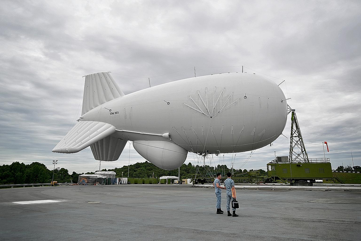 The tethered 55m-long helium-filled balloon at Choa Chu Kang Camp yesterday. When operational, the aerostat will be able to offer round-the- clock surveillance.