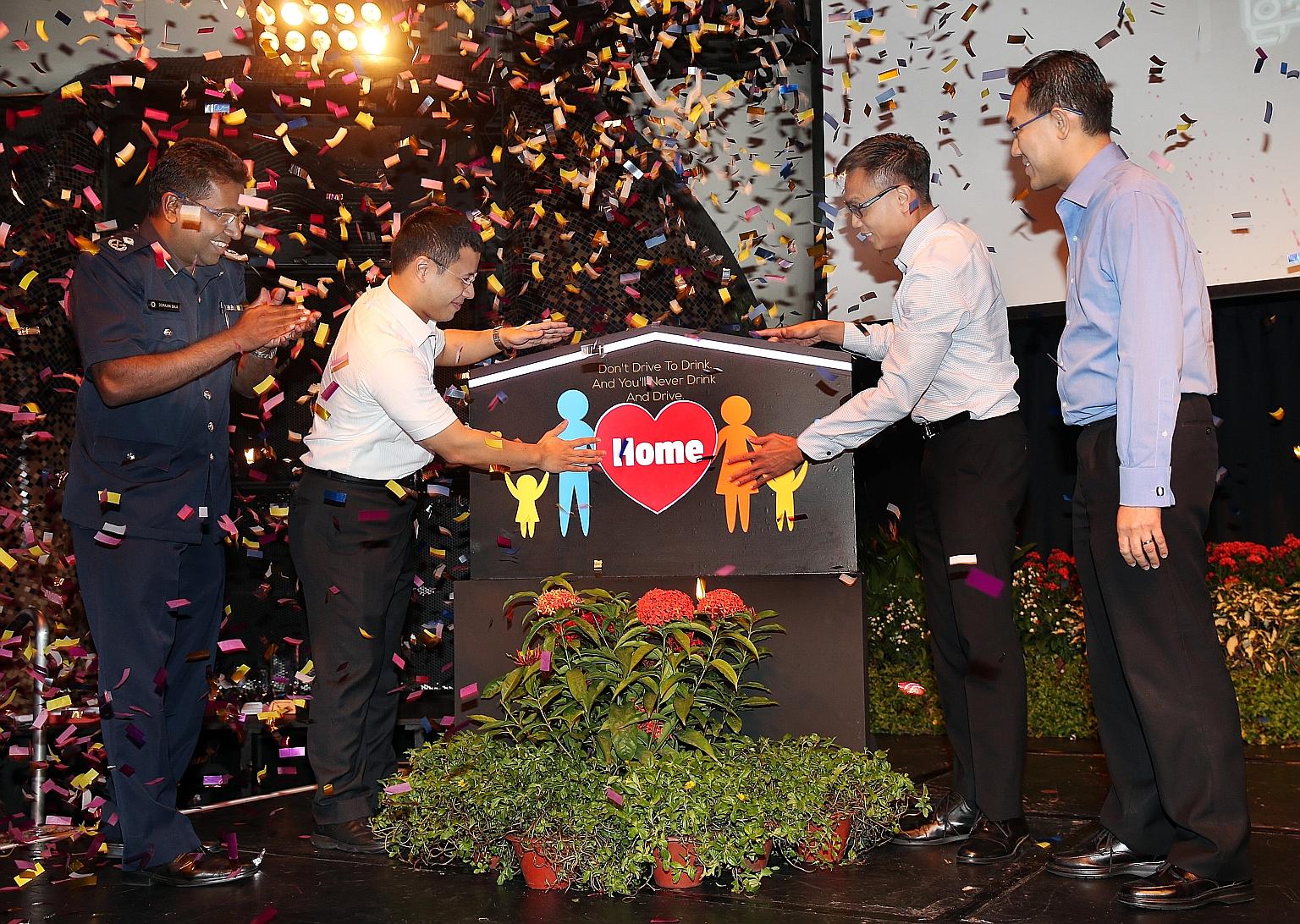 From left: Deputy commander of the Traffic Police and assistant commissioner of police Devrajan Bala, Senior Minister of State Desmond Lee, executive director of the Singapore Road Safety Council, Mr Chua Chee Wai, and executive vice-president of the