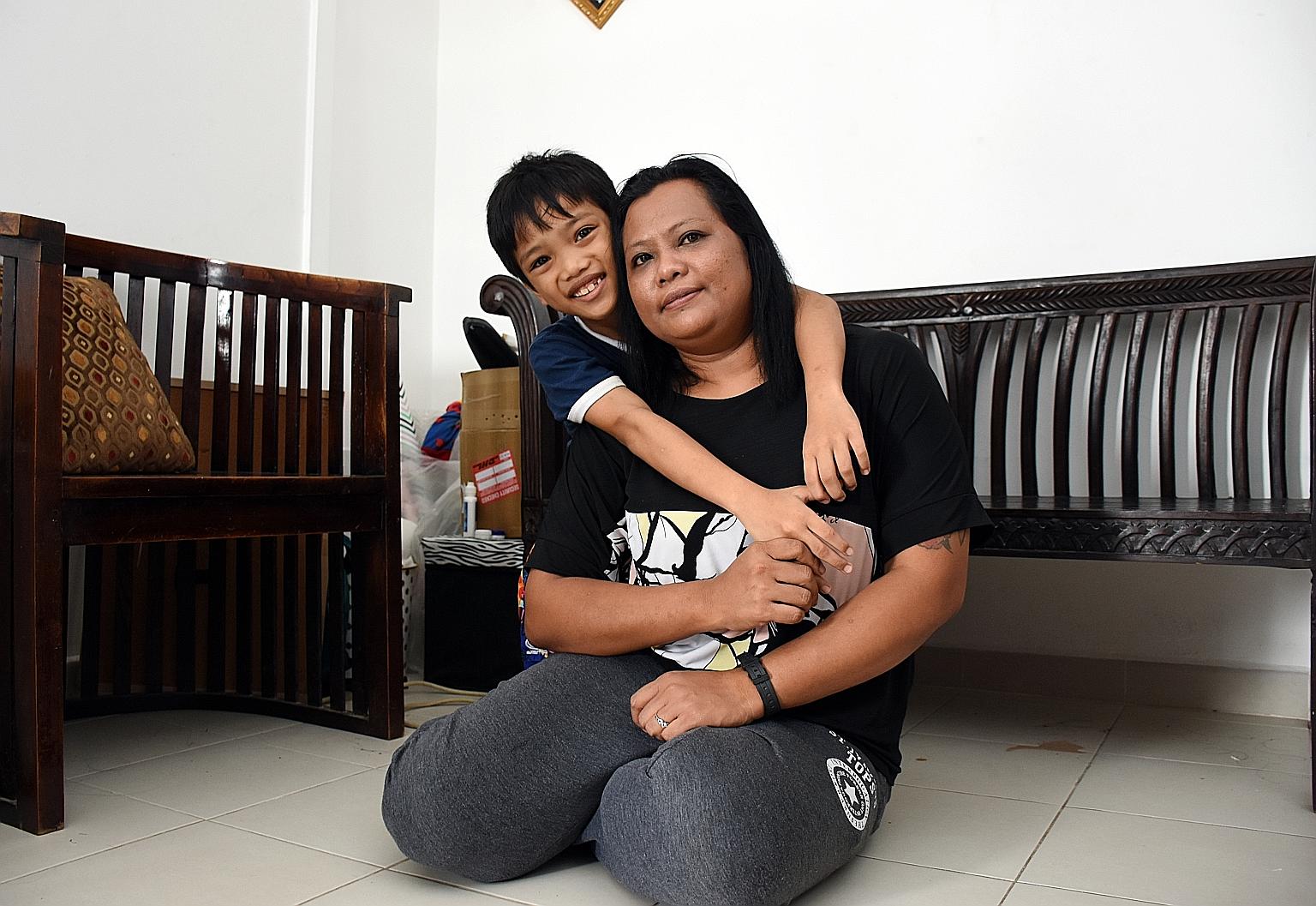 Madam Jamnah Hamzah, seen here with her son Adrian Mazuan, is keen to apply for the Fresh Start Housing Scheme to give her family a better future.
