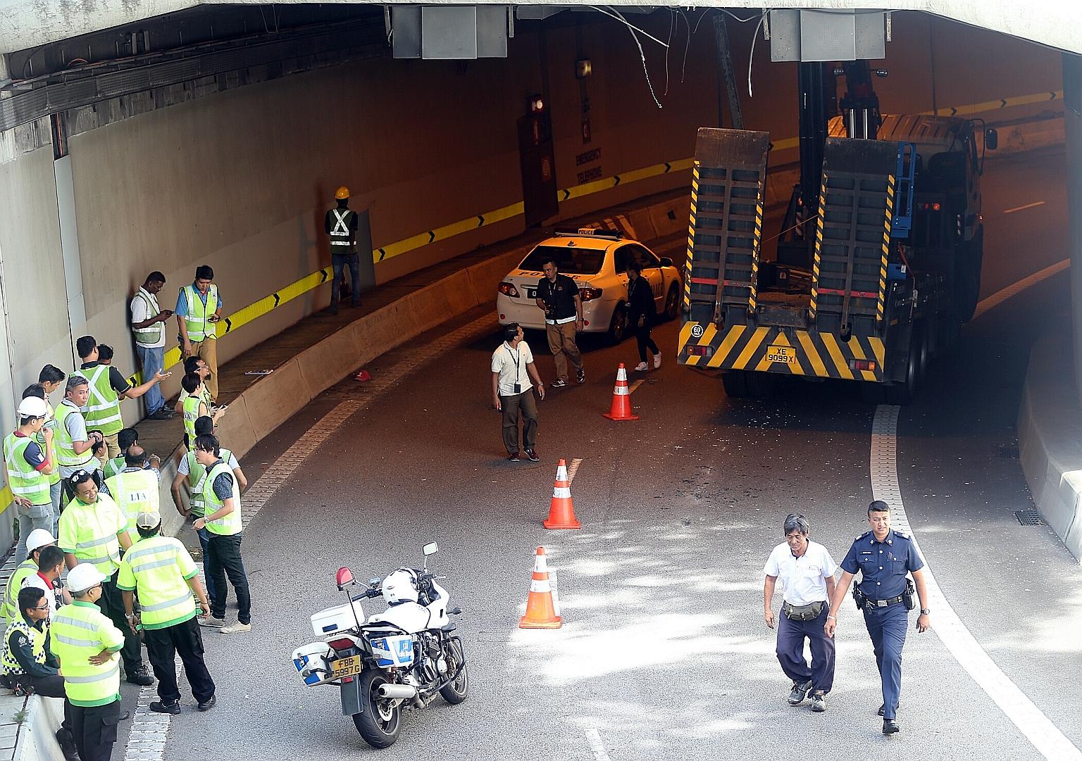 The lorry was on the slip road to the Central Expressway in Upper Cross Street yesterday when its crane struck the roof of the tunnel at around 1pm. The tunnel was reopened only around 6pm. Police said the 63-year-old driver was arrested.