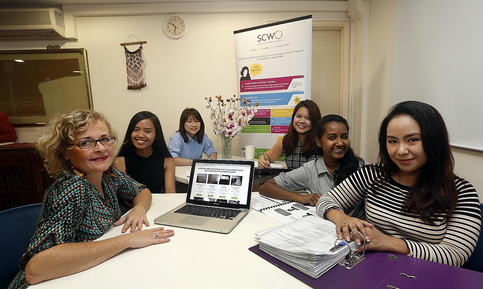 (From left) Papayapaths' Ms Boutin-Becuwe and SCWO staff Elena Karim, Amanda Ho, Denise Balhetcher, Rosabella Ann Renee Robert and Elaine Danielle Juan with the tables SCWO received from Ibis Singapore on Bencoolen.