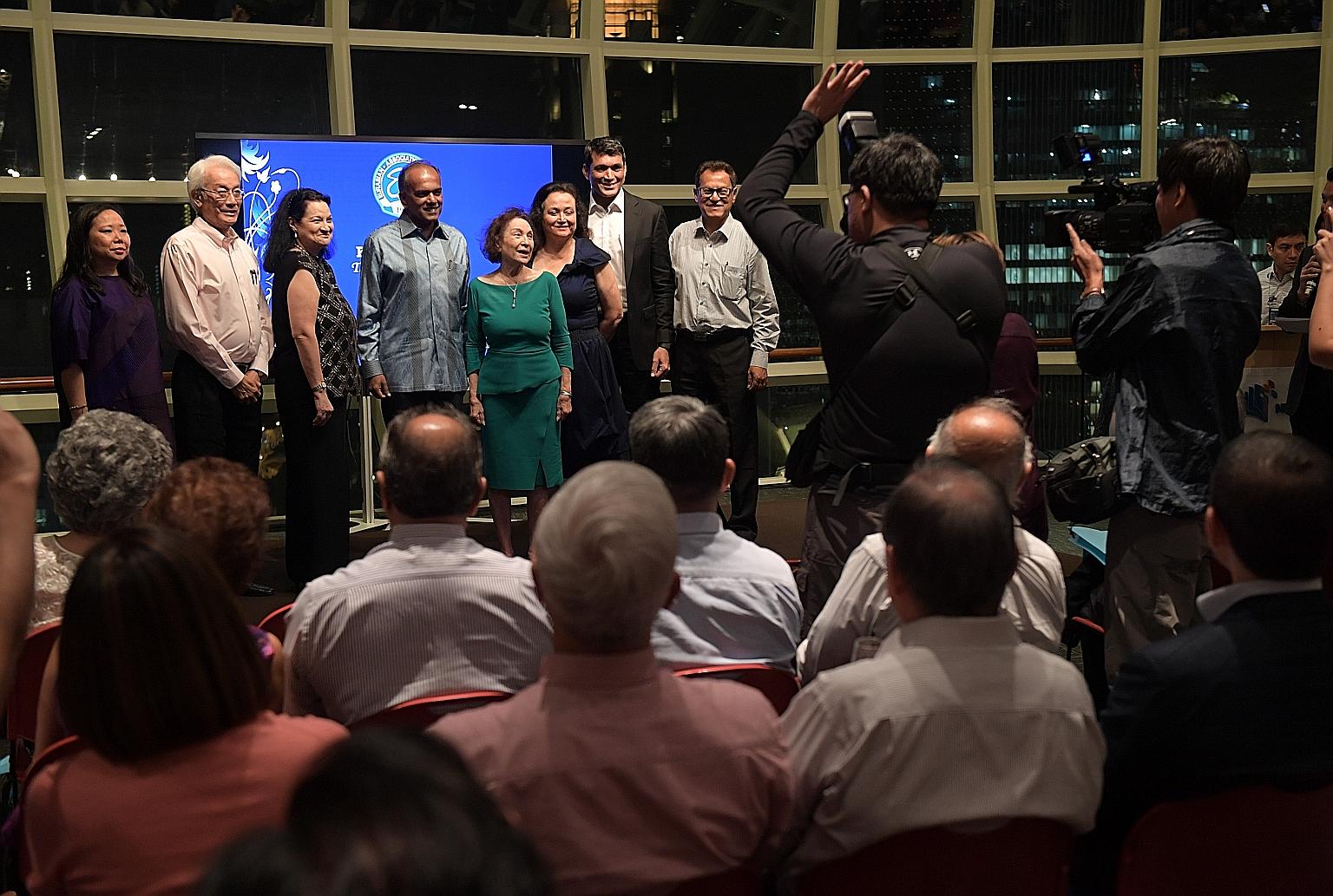 At the launch of the biography are (from left) the book's author Susan Sim; Eurasian Association former president Edward d'Silva; Ms Carla Barker; Mr Shanmugam, Mrs Gloria Barker; Ms Deborah Barker; Eurasian Association president Benett Theseira; and