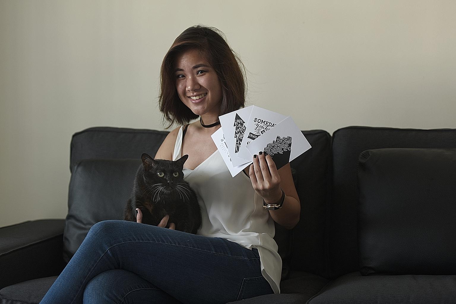 Ms Chew with one of the two cats her family adopted. The 24-year-old hand-letterist, who is selling hand-drawn cards to raise money for Oasis Second Chance Animal Shelter, hopes to raise $500 by this month.