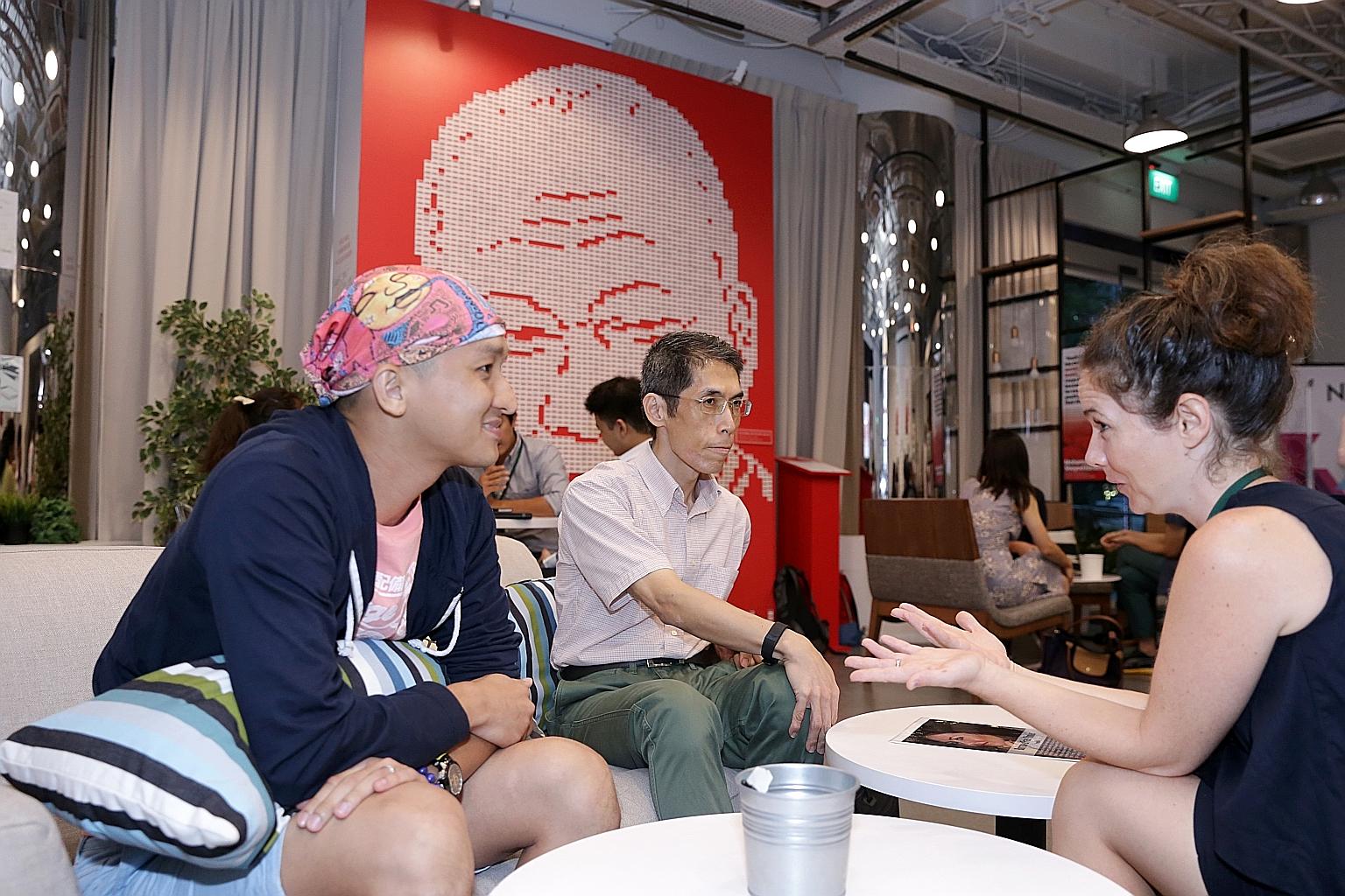 Human Library events allow people from different social backgrounds to engage in open conversation. Speakers, acting as "books", share their life stories, as Ms Pernille Bussone from Cycling Without Age is doing above with "readers" Andy Sim (far lef