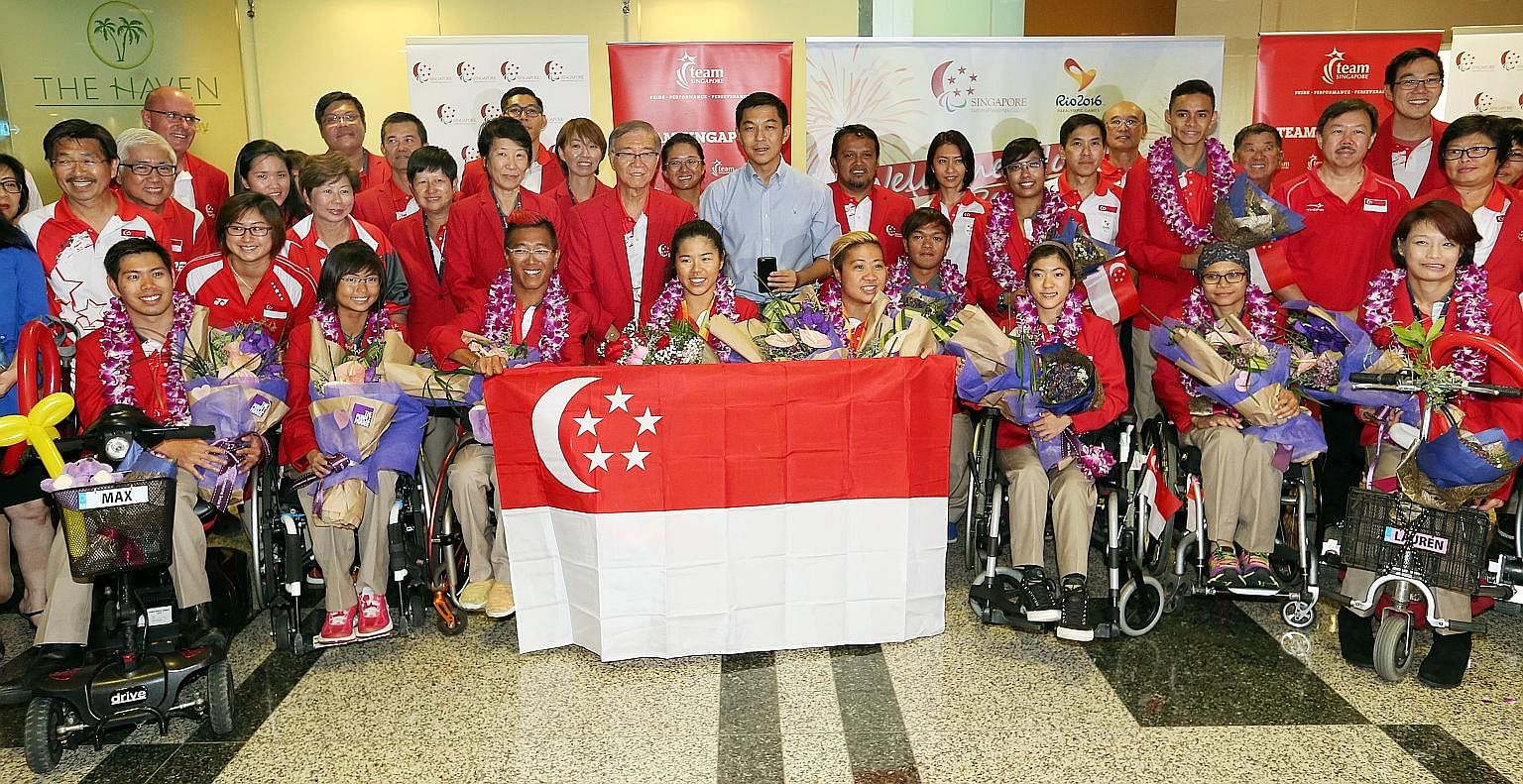Team Singapore's Paralympians in a group photo at Changi Airport on Sept 21. Giving all the para-athletes free or subsidised rides could ease their commute to and from training and spur them to continue doing their best.