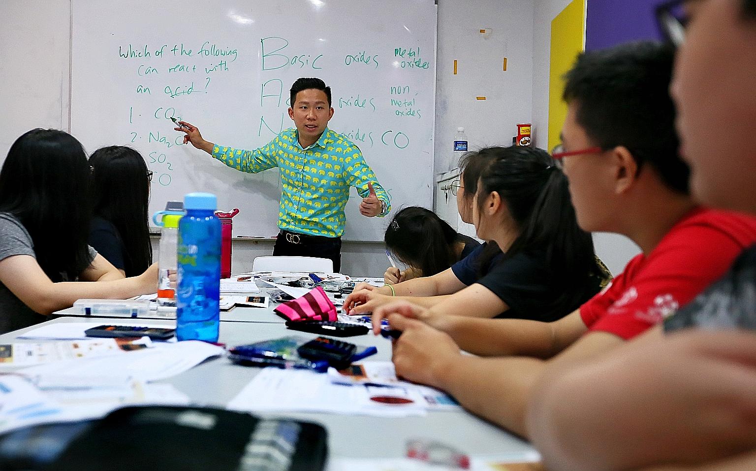 Bright Culture founder Joel Liu during a chemistry session with secondary students. He said the holiday period is crucial for those taking major exams next year.
