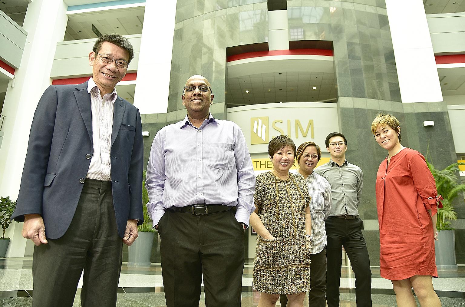 The team involved in setting up SIM's new international school includes (from left) Dr Lee, Mr Balamurugan, Ms Clare Wee, Ms Darrell Foo, Mr Kenneth Chee and Ms Wang Li-Sa. The school curriculum will focus on preparing students for the International