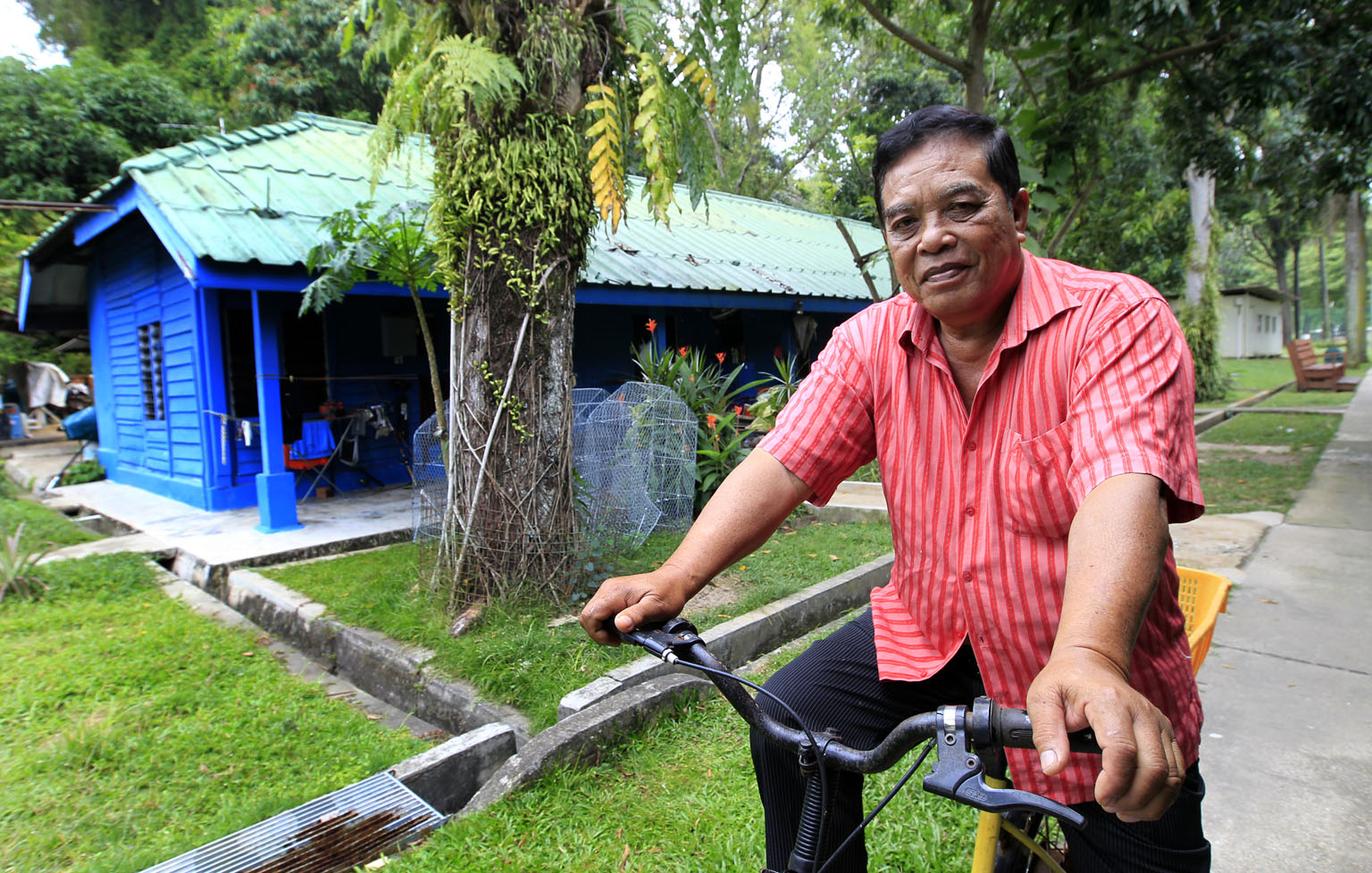 Mr Sulih and his home on the island. St John's was where he was born 71 years ago, grew up and got married. He retired as one of the island's caretakers in 2010 and is one of only four occupants there.
