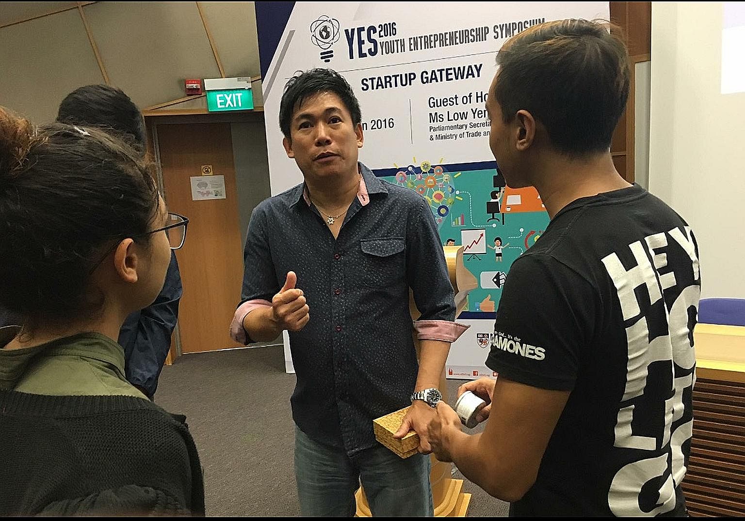 Mr Tan with students at the NUS Business School after giving a talk on social entrepreneurship. He also makes prison visits to counsel and encourage young inmates. Mr Tan (left) with friends in a photo taken when he was 21, just before he was sentenc
