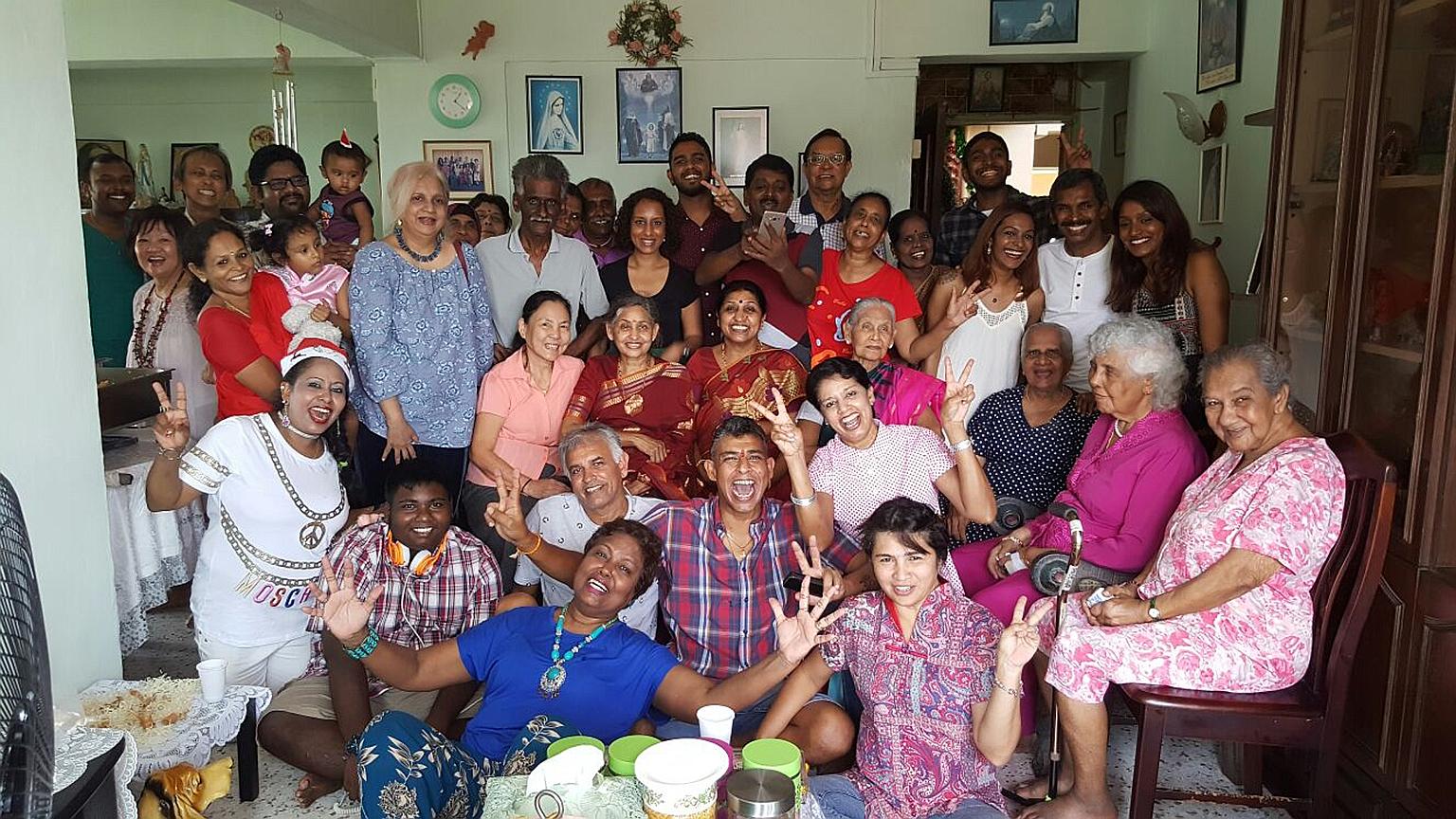 For 30-plus years, cross-cultural and multi-religious harmony has been the theme of Christmas gatherings at the home of Ms Angela Christina Perumal-Schooling (front row, in blue). While her father's side of the family is Hindu, her mother's side is C