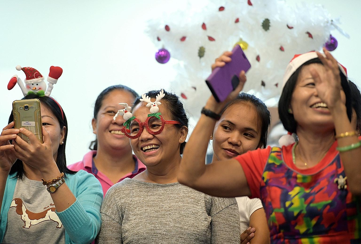Decked out in colourful apparel, domestic workers from various countries and religious traditions flocked to the Foreign Domestic Worker Association for Social Support and Training's free Christmas Day party.