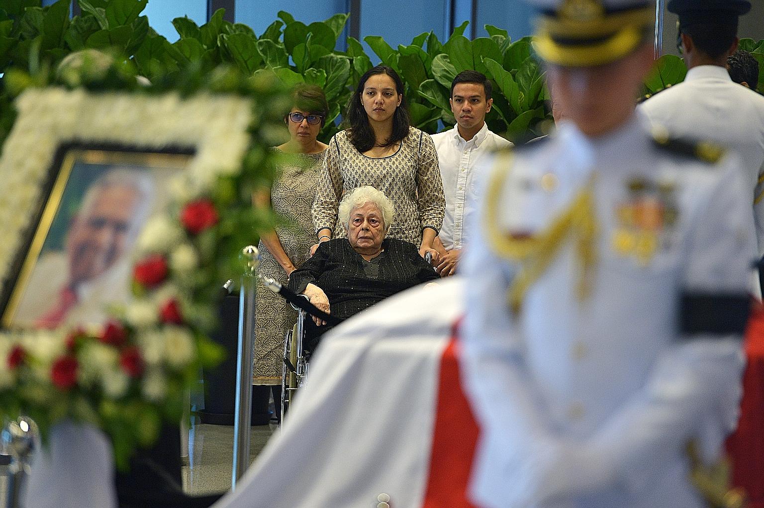Madam Urmilla Umi Nandey (in wheelchair), wife of former president Nathan, with her children at Parliament House on Aug 25, three days after his death. Mr Nathan died at the age 92.