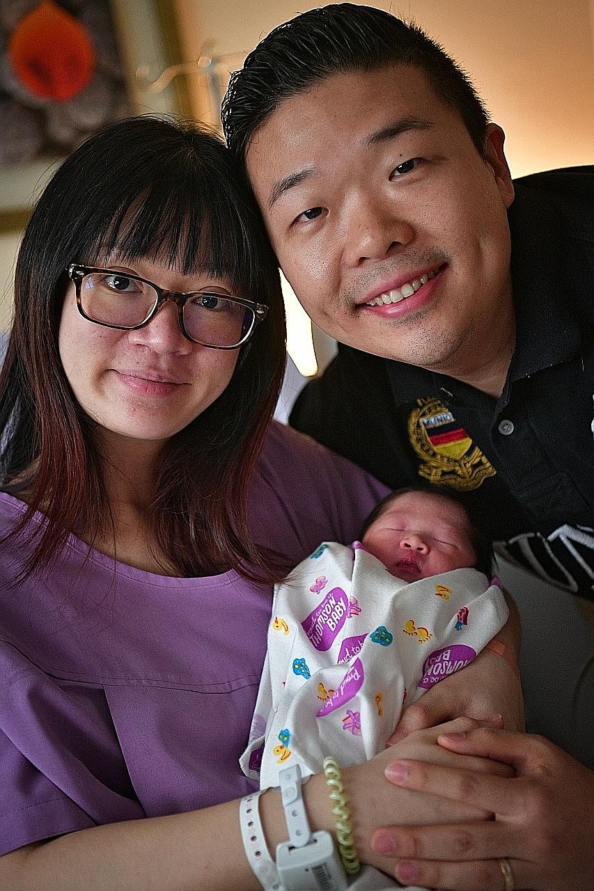Above: Ms Loy and Mr Yap with their baby boy, who has yet to be named, at Thomson Medical Centre yesterday. He was the second baby of 2017, born at 12.53am. Left: Ms Chia and Dr Liu with their daughter Arielle, also born at Thomson Medical Centre at 