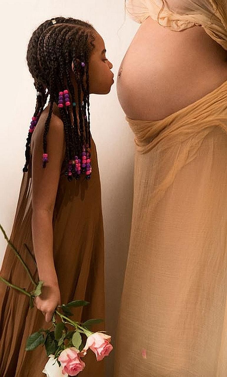 Superstar Beyonce posted photos of her pregnant self, including ones with her daughter Blue Ivy, on her website.