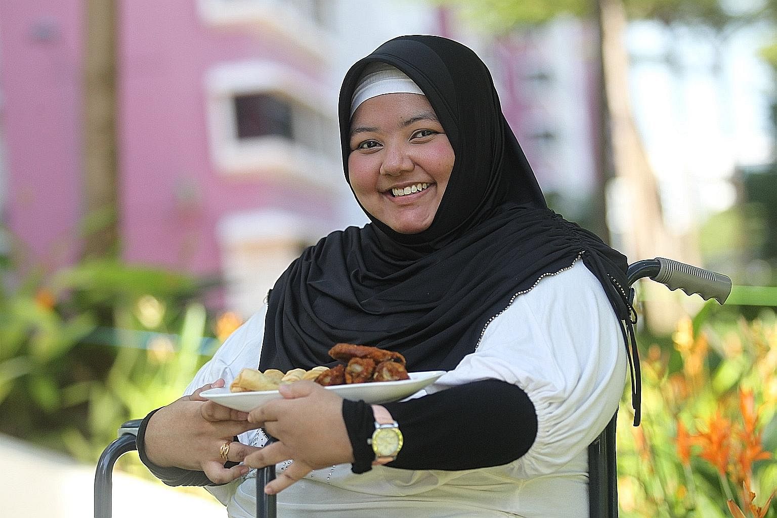 Ms Noor Ain Masaid, who used to be bedridden, started her ChixCheese food business in 2007. Today, she is able to produce the food on her own and donates profits from some orders to those in need.