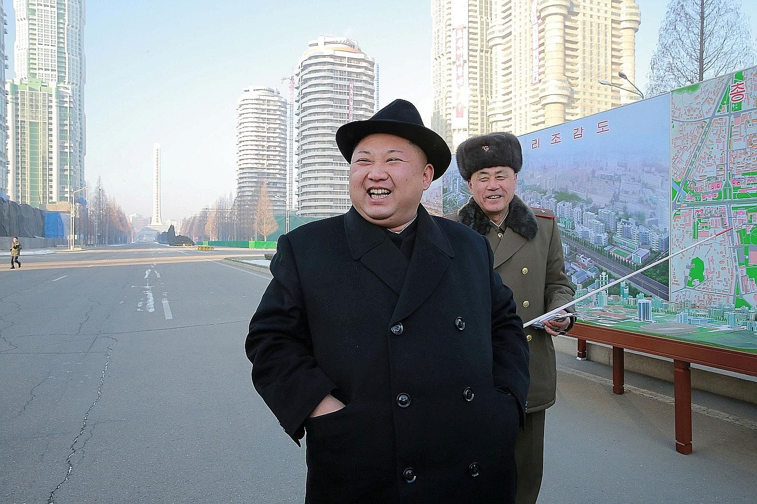 An undated photo of Mr Kim Jong Un inspecting a construction site, released by North Korea's Korean Central News Agency last month. Experts say he may have viewed his brother as a thorn and felt the need to eliminate him.