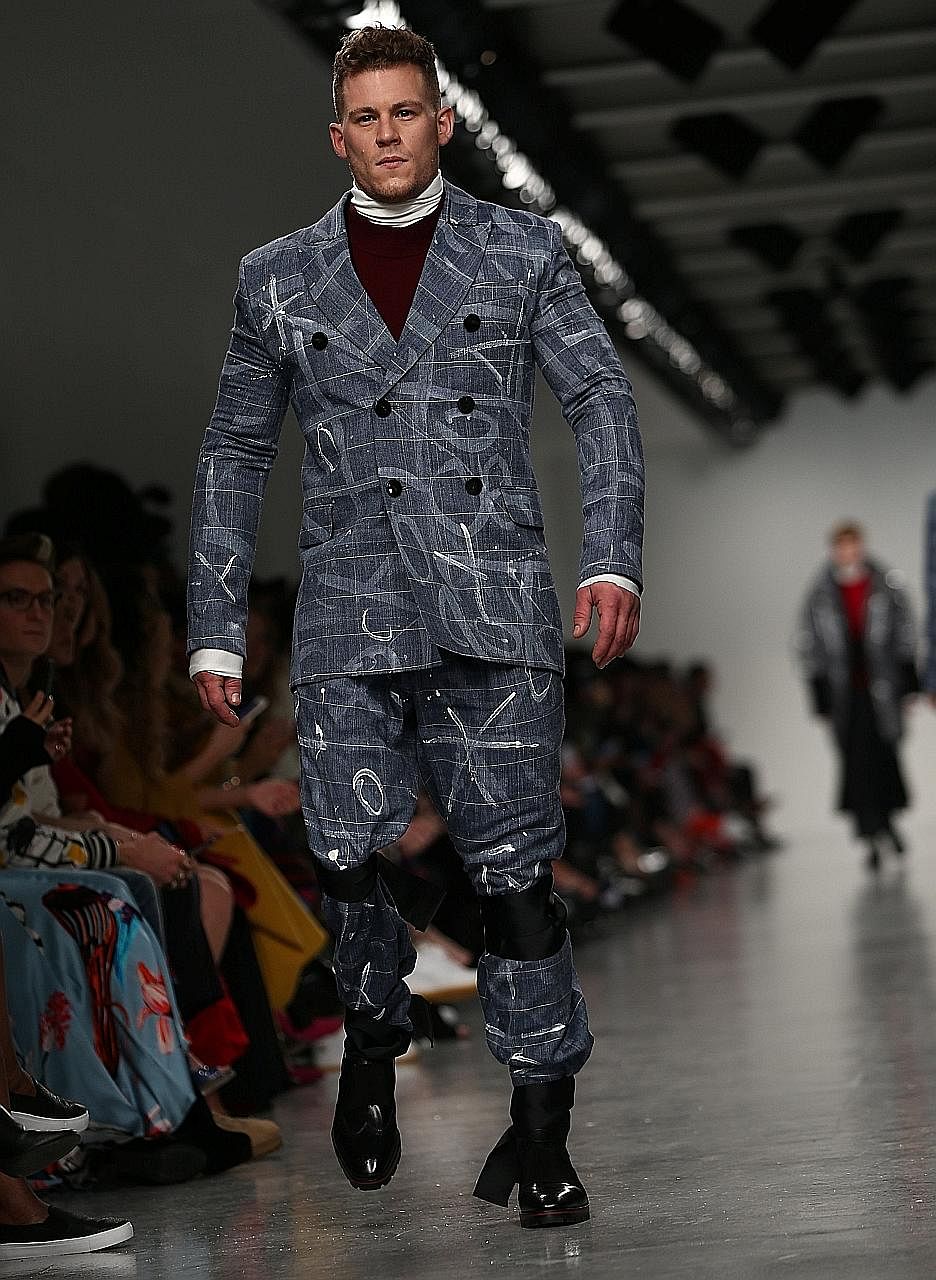 Model Jack Eyers, who wears a prosthetic leg, on the runway for British luxury label Teatum Jones during London Fashion Week.